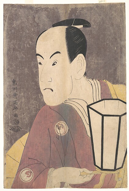 A kabuki actor half-length portrait holding a lantern, a maroon robe over a yellow under-robe, against a shimmering ground of white mica
